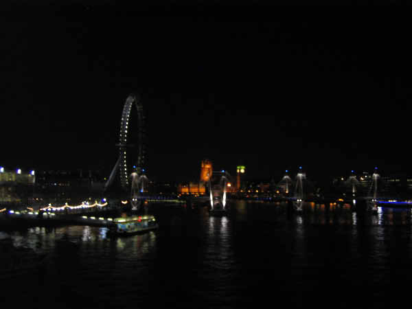 London at night across the Thames.